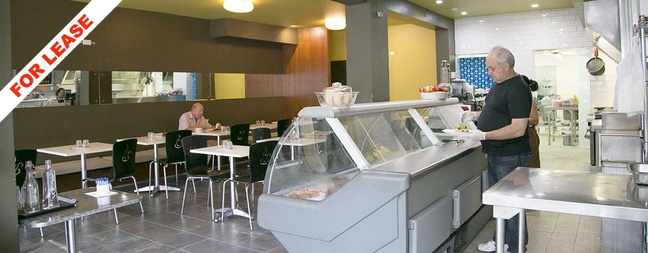 Servery, display fridge and dining area inside 188 Harris Street